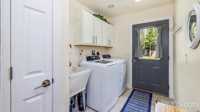 6376 Marie L.45 Ln, Escanaba, MI 49829 - laundry room featuring washer and clothes dryer and cabinet space