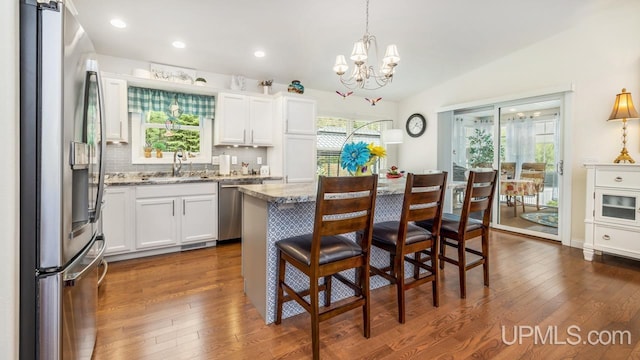 6376 Marie L.45 Ln, Escanaba, MI 49829 - kitchen featuring stainless steel appliances, a sink, a chandelier, plenty of natural light, and recessed lighting
