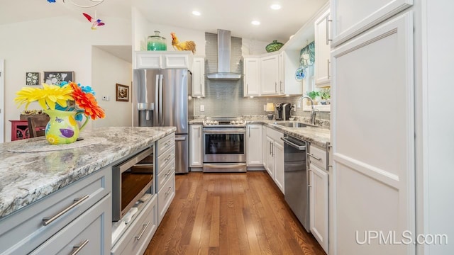 6376 Marie L.45 Ln, Escanaba, MI 49829 - kitchen with appliances with stainless steel finishes, wall chimney range hood, a sink, backsplash, and recessed lighting