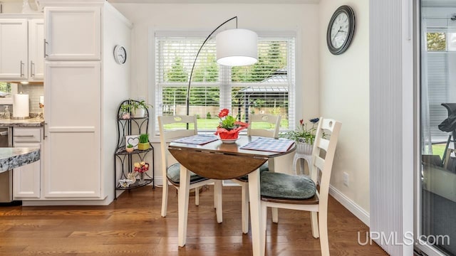 6376 Marie L.45 Ln, Escanaba, MI 49829 - dining room with wood finished floors and plenty of natural light