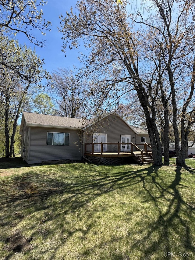 59 Forest Dr, Negaunee, MI 49866 - back of property with a wooden deck and a lawn