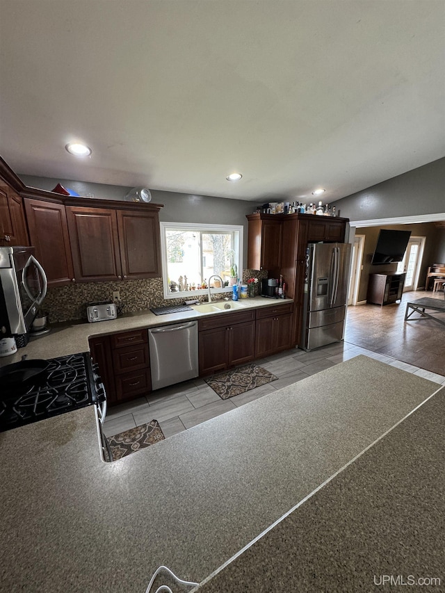 59 Forest Dr, Negaunee, MI 49866 - kitchen featuring appliances with stainless steel finishes, a sink, backsplash, recessed lighting, and dark brown cabinets