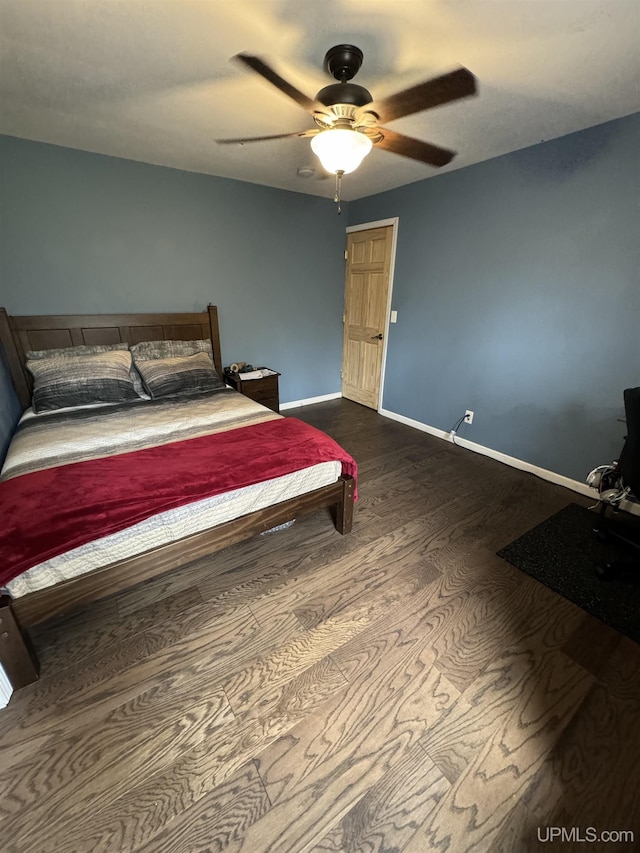 59 Forest Dr, Negaunee, MI 49866 - bedroom with dark wood-type flooring, baseboards, and a ceiling fan