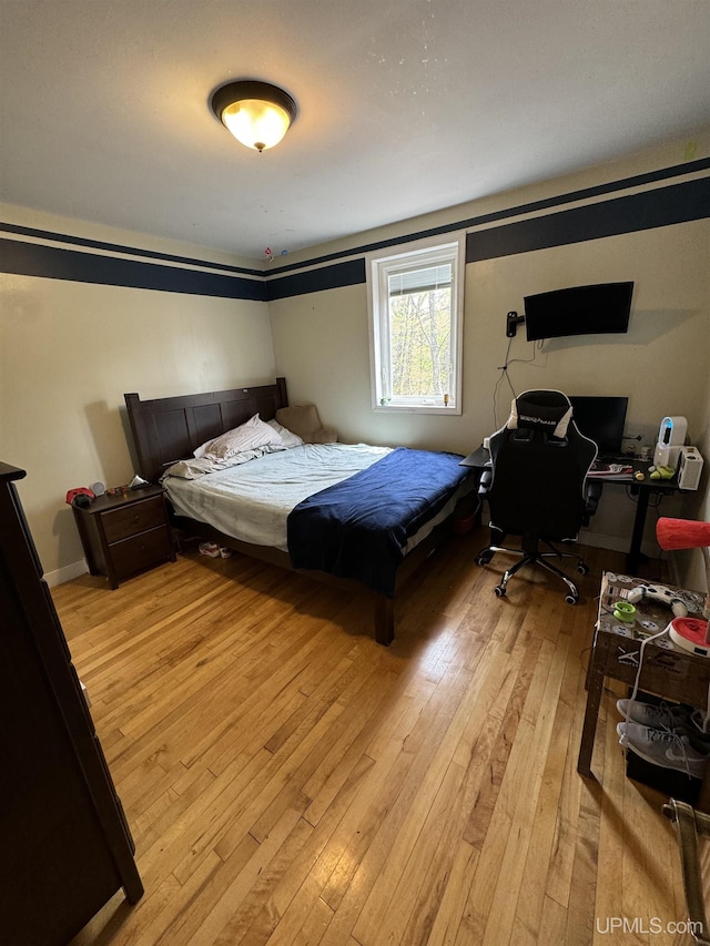 59 Forest Dr, Negaunee, MI 49866 - bedroom with light wood-style flooring and an office area