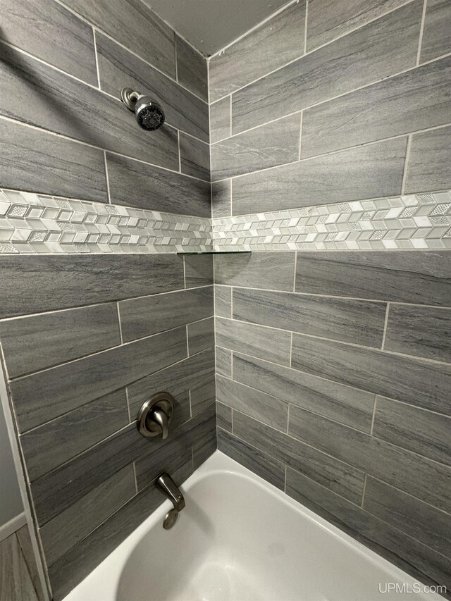 59 Forest Dr, Negaunee, MI 49866 - bathroom featuring washtub / shower combination
