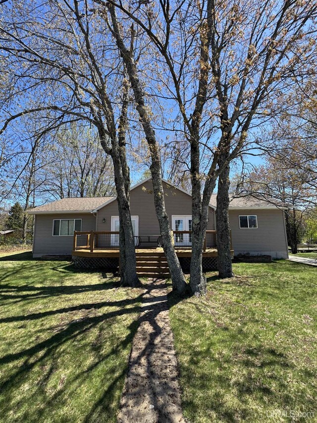 59 Forest Dr, Negaunee, MI 49866 - view of front of property with a deck and a front yard