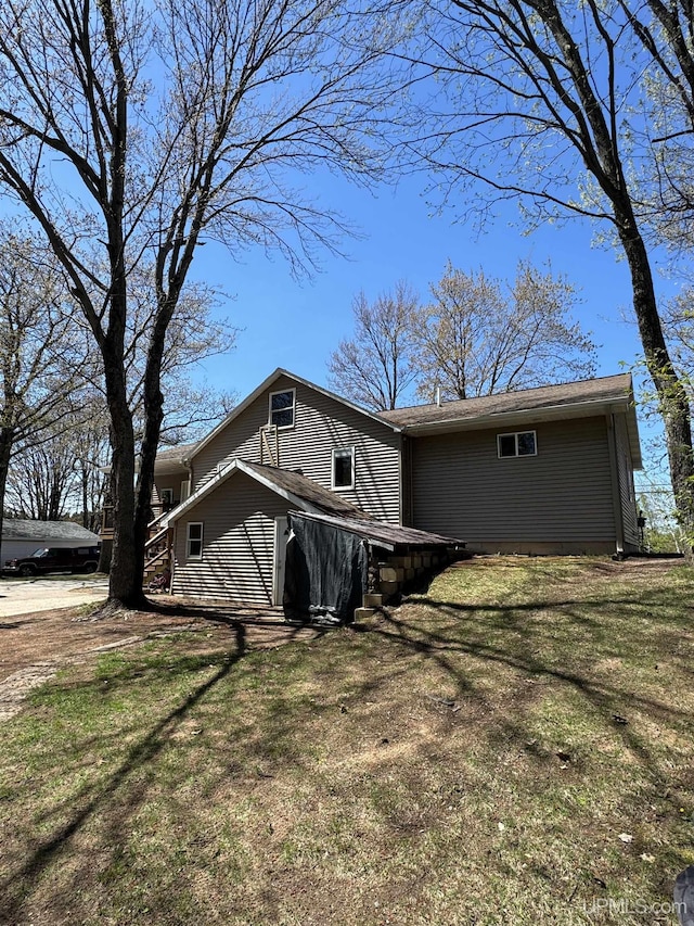 59 Forest Dr, Negaunee, MI 49866 - view of front of house featuring a front yard