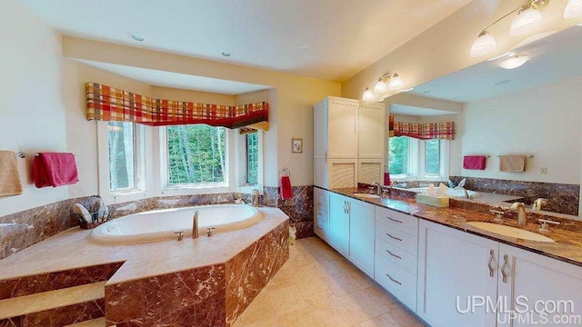 N9910 Shore Dr, Au Train, MI 49806 - bathroom with a bath, double vanity, and tile patterned floors