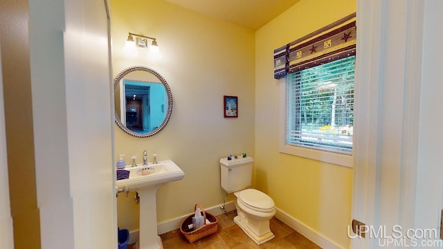 N9910 Shore Dr, Au Train, MI 49806 - half bath with baseboards and toilet