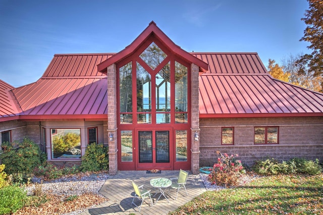 N9910 Shore Dr, Au Train, MI 49806 - view of front of house with a standing seam roof and metal roof