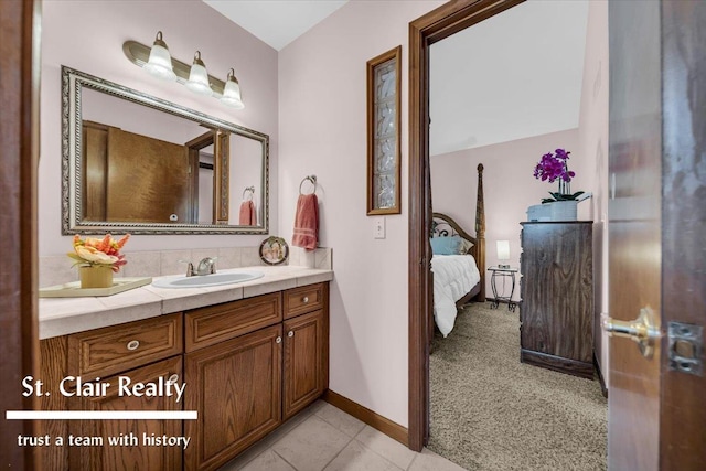 1080 Highland Dr, Saint Clair, MI 48079 - ensuite bathroom featuring vanity, baseboards, and tile patterned floors