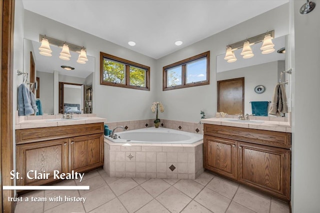 1080 Highland Dr, Saint Clair, MI 48079 - full bathroom featuring a garden tub, two vanities, and tile patterned floors