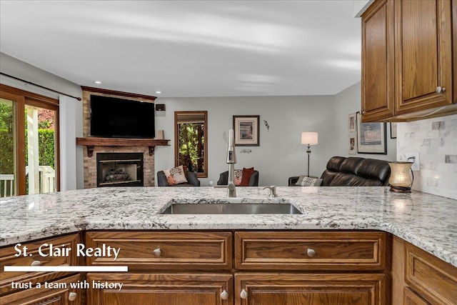1080 Highland Dr, Saint Clair, MI 48079 - kitchen with a sink, open floor plan, and light stone countertops