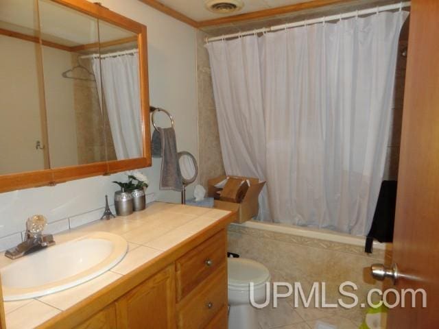 2801 M-94 Hwy, Eben Junction, MI 49825 - full bath featuring vanity, tiled shower / bath, and toilet