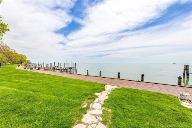 49016 Pointe Lakeview Dr, Chesterfield, MI 48047 - view of grassy yard with a water view and a boat dock
