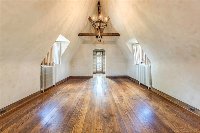 49016 Pointe Lakeview Dr, Chesterfield, MI 48047 - bonus room featuring radiator heating unit, hardwood / wood-style floors, a chandelier, and vaulted ceiling