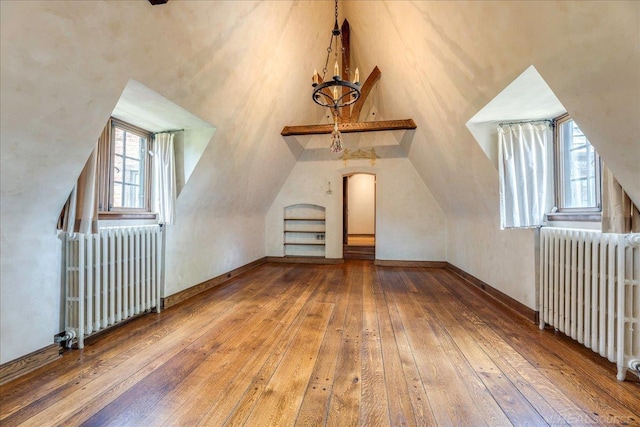 49016 Pointe Lakeview Dr, Chesterfield, MI 48047 - additional living space featuring radiator heating unit, hardwood / wood-style flooring, and lofted ceiling