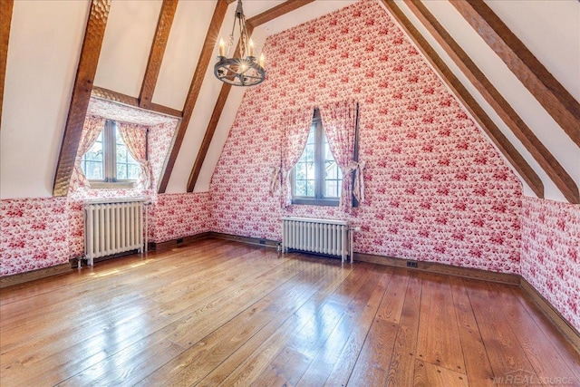 49016 Pointe Lakeview Dr, Chesterfield, MI 48047 - bonus room with radiator, plenty of natural light, wood-type flooring, and wallpapered walls