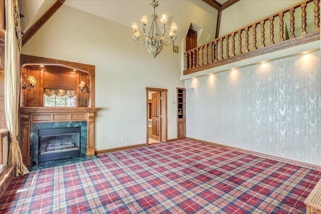 49016 Pointe Lakeview Dr, Chesterfield, MI 48047 - unfurnished living room featuring a high ceiling, a chandelier, carpet, a fireplace, and baseboards