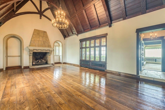 49016 Pointe Lakeview Dr, Chesterfield, MI 48047 - unfurnished living room featuring a chandelier, wood-type flooring, plenty of natural light, wood ceiling with exposed beams, and high vaulted ceiling