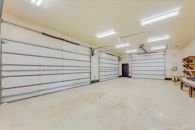 49016 Pointe Lakeview Dr, Chesterfield, MI 48047 - garage featuring a garage door opener