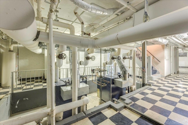 49016 Pointe Lakeview Dr, Chesterfield, MI 48047 - exercise room featuring tile patterned floors, water heater, and healthy amount of natural light