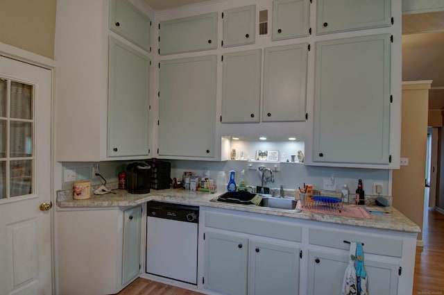 6669 Lakeshore Rd, Lexington, MI 48450 - kitchen with dishwasher, a sink, light countertops, and light wood-style flooring