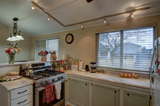 6669 Lakeshore Rd, Lexington, MI 48450 - kitchen featuring rail lighting, stainless steel gas range, ornamental molding, and hanging light fixtures