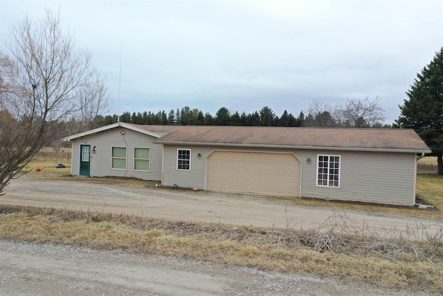 6669 Lakeshore Rd, Lexington, MI 48450 - ranch-style house featuring driveway and a garage