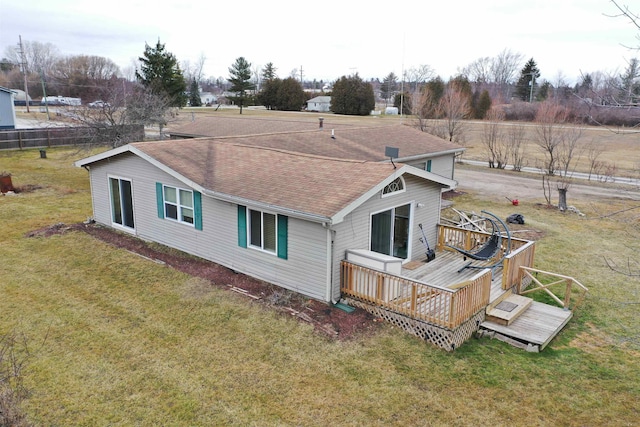 6669 Lakeshore Rd, Lexington, MI 48450 - back of property featuring a wooden deck, roof with shingles, and a lawn