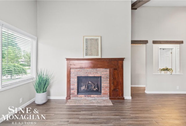 22574 Katzman St, Clinton Township, MI 48035 - unfurnished living room featuring wood finished floors, a brick fireplace, and baseboards