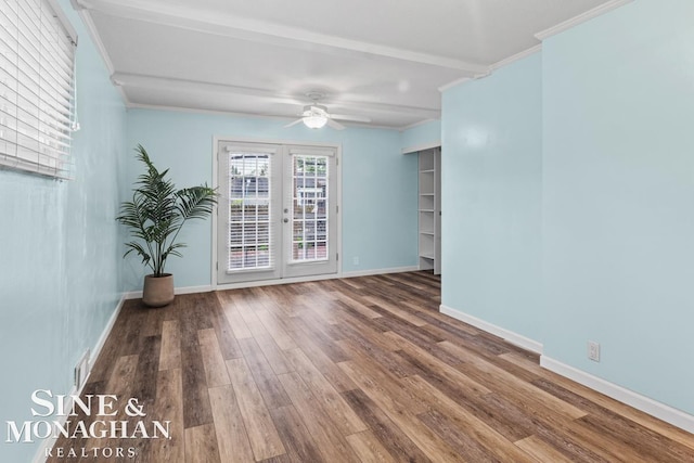 22574 Katzman St, Clinton Township, MI 48035 - spare room featuring wood finished floors, a ceiling fan, french doors, crown molding, and baseboards