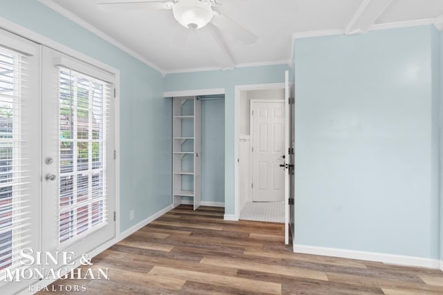 22574 Katzman St, Clinton Township, MI 48035 - unfurnished room with wood finished floors, crown molding, a ceiling fan, and baseboards