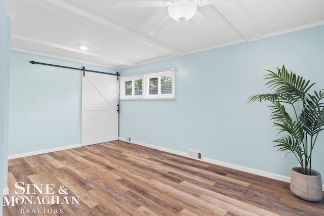 22574 Katzman St, Clinton Township, MI 48035 - unfurnished bedroom with a barn door, beamed ceiling, wood finished floors, baseboards, and ceiling fan