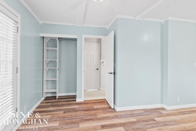 22574 Katzman St, Clinton Township, MI 48035 - unfurnished bedroom featuring wood finished floors, crown molding, baseboards, a closet, and a ceiling fan