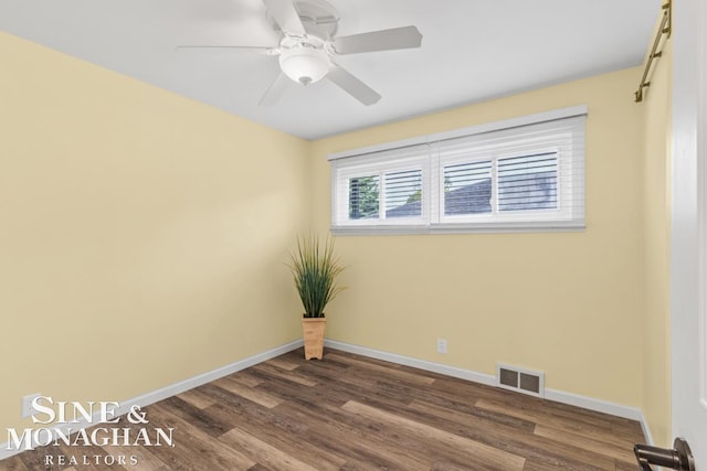 22574 Katzman St, Clinton Township, MI 48035 - spare room featuring dark wood-type flooring, baseboards, and a ceiling fan