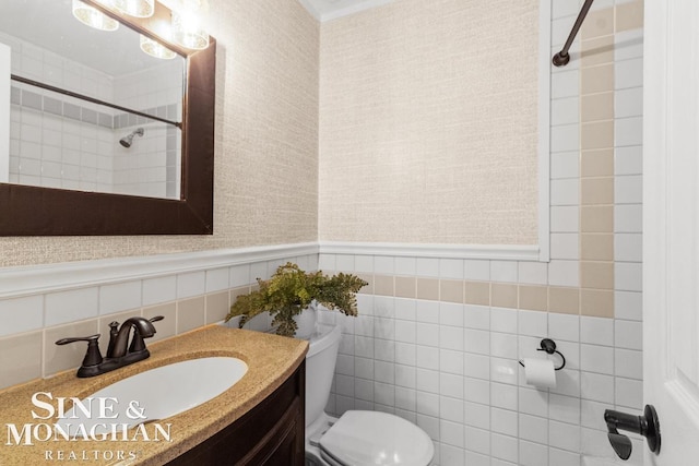 22574 Katzman St, Clinton Township, MI 48035 - bathroom with toilet, vanity, a shower, tile walls, and a wainscoted wall