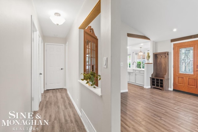 22574 Katzman St, Clinton Township, MI 48035 - foyer with light wood finished floors, baseboards, recessed lighting, and vaulted ceiling