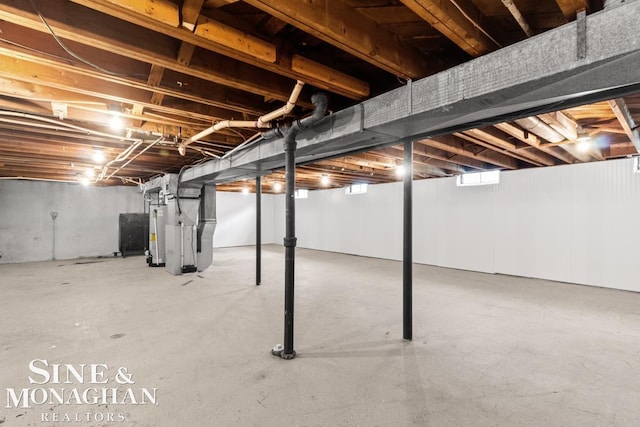 22574 Katzman St, Clinton Township, MI 48035 - unfinished basement featuring gas water heater and heating unit