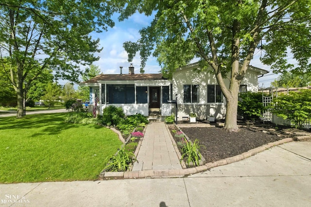 22574 Katzman St, Clinton Township, MI 48035 - view of front of property featuring a front yard, a sunroom, and a chimney