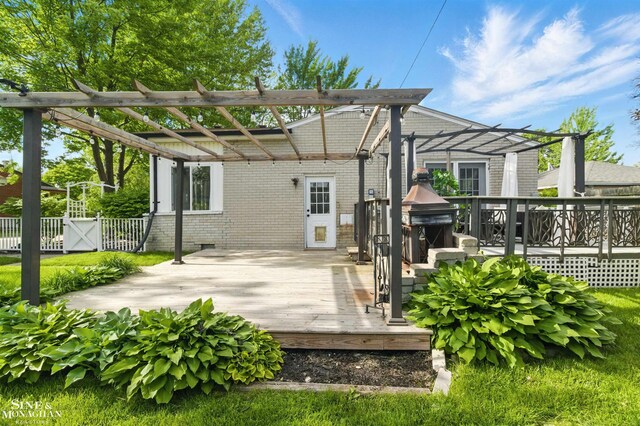 22574 Katzman St, Clinton Township, MI 48035 - rear view of house with brick siding, a wooden deck, and a pergola