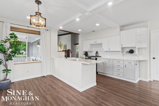 22574 Katzman St, Clinton Township, MI 48035 - kitchen with a sink, dark wood-style floors, white cabinets, backsplash, and light countertops