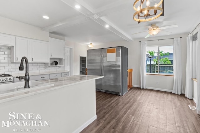 22574 Katzman St, Clinton Township, MI 48035 - kitchen with freestanding refrigerator, a sink, beamed ceiling, baseboards, and decorative backsplash