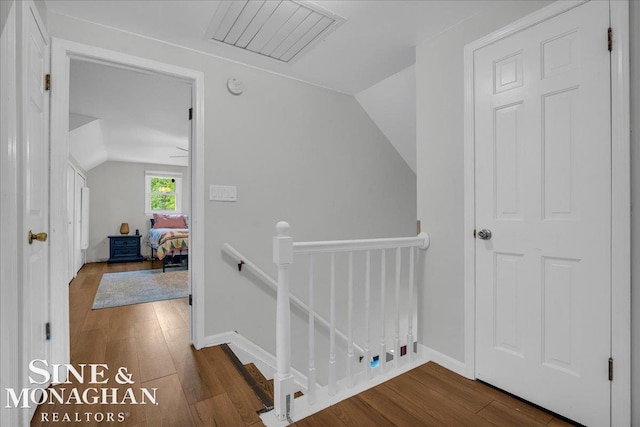 1923 Clinton Ave, Saint Clair, MI 48079 - corridor with an upstairs landing, lofted ceiling, wood finished floors, and baseboards