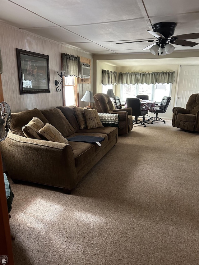1923 Bear Dr, Oscoda, MI 48750 - carpeted living room featuring ceiling fan, a wall unit AC, and wood walls