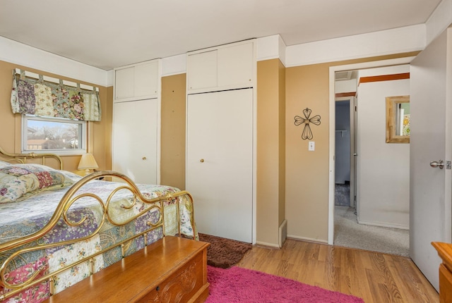 5149 Reinhardt Ln, Bay City, MI 48706 - bedroom featuring light wood-type flooring, a closet, and baseboards