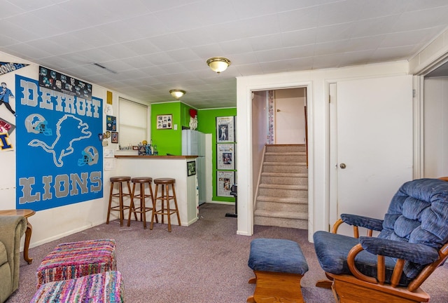 5149 Reinhardt Ln, Bay City, MI 48706 - living area featuring carpet flooring, stairway, a bar, and baseboards