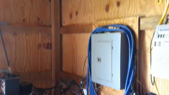 7880 S Dyer Dr, Falmouth, MI 49632 - detailed view of electric panel and wood walls