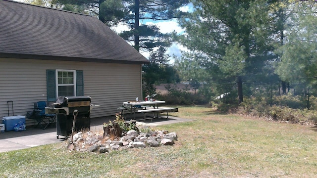 7880 S Dyer Dr, Falmouth, MI 49632 - view of green lawn featuring a patio area