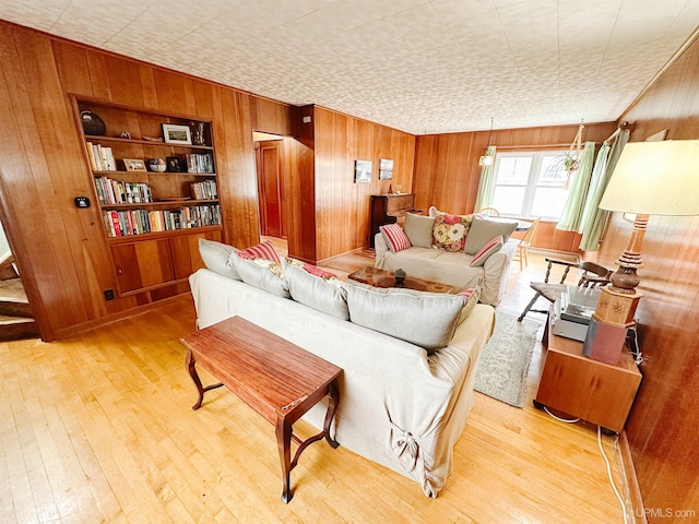 812 Spruce St, Marquette, MI 49855 - living room with wood walls, light wood-type flooring, and built in shelves